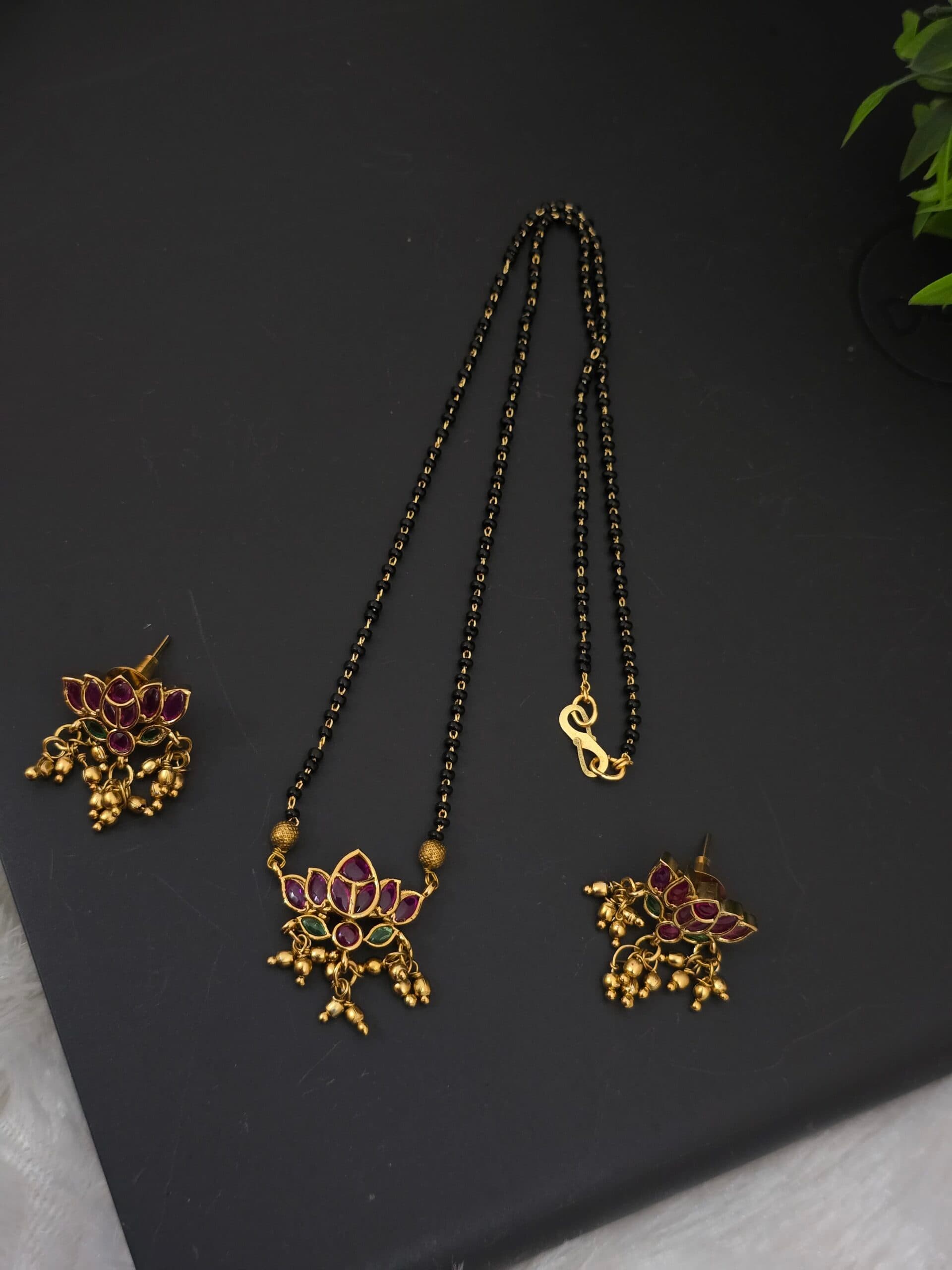 Premium matt kemp lotus black beats necklace with earings