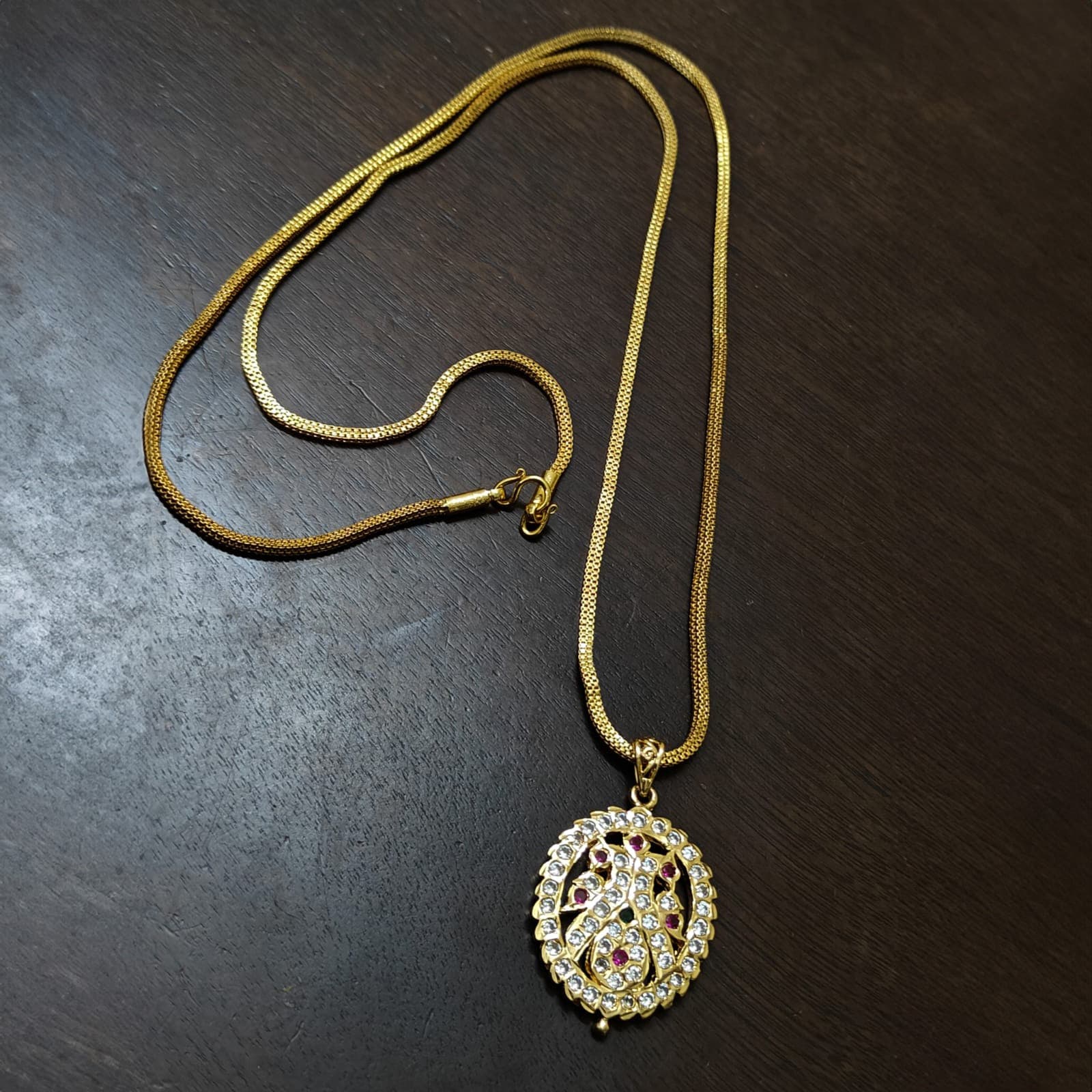 Traditional impon peacock oval dollar chain